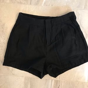 High waisted black pleated shorts